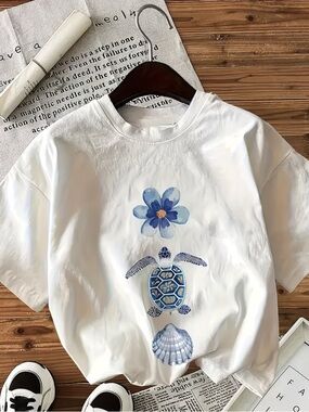 White Women's Graphic Tee with Blue Turtle & Flower Motif